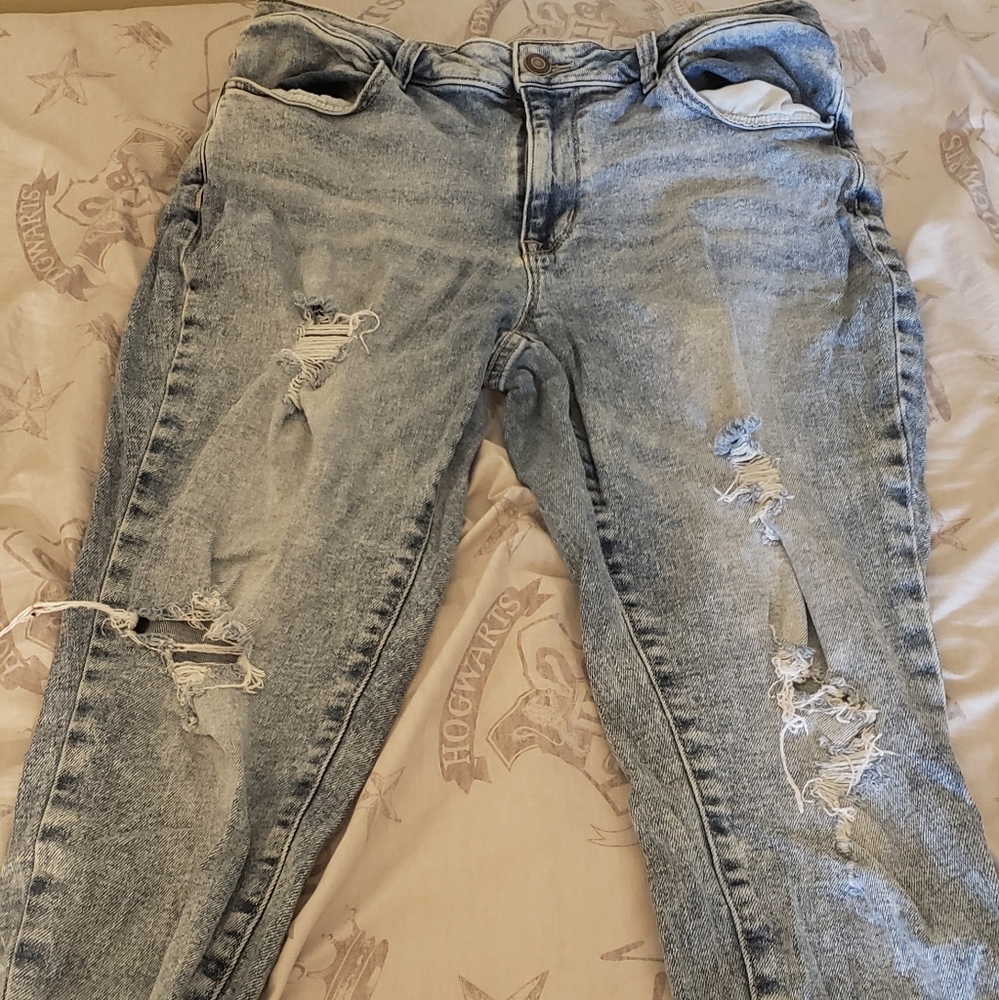 Mid-rise, ripped, faded, blue jeans